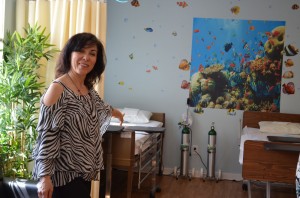Linda Thomas, the founder of The Parents Group, shows off the Red Ribbon Academy. The Parents Group is group of five mothers who developed the concept of the Red Ribbon Academy and collaborated with Community Options to open this Medical Special Needs Day Program. Celebrating Two Years of Making a Difference - Community Options’ Red Ribbon Medical Day Program.