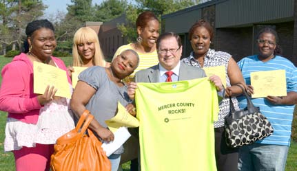 Picture from left to right: Tiffany Thomas, Khadijah Brown, Khalilah Smith, Kelly Houston, Talaya Peterson Front row: Cheryl Harris and Sam Nussbaum, Executive Director.