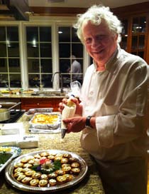 Longtime board member, Peter Dulligan, Chef-Owner of Griffin’s Bar and Grill prepares hors d’oeuvres at the home of Scott and Alex Leibold.
