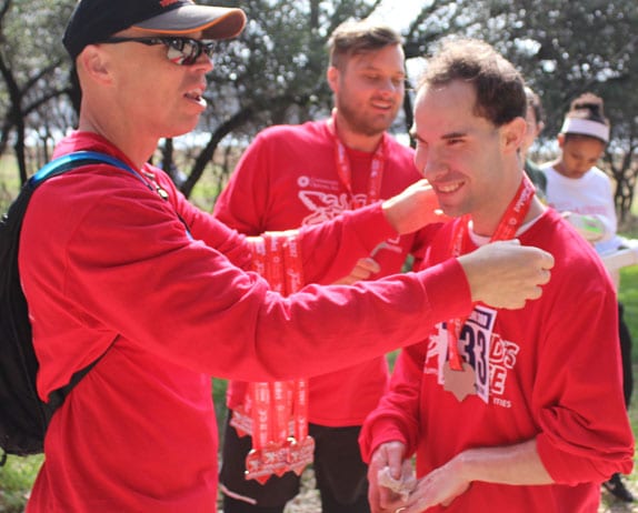 Cupid's Chase race participant receiving a medal