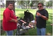 Lawrence Baca & Anthony Montano grill hamburgers for the Community Options Albuquerque Picnic, July 10, 2006.
