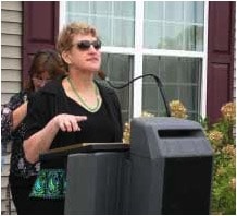 Terry Morrison addresses the crowd and thanks the people who made it possible for her to live outside the institution.