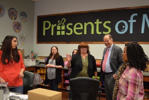 In May of 2014, Governor Thomas H. Kean, the 48th Governor of New Jersey, visits with the employees at Presents of Mind, a gift shop owned and operated by Community Options