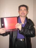 Mark Jenner receives an award from Taco Bell for his 10-years of service. - El Paso, Texas