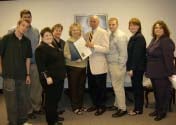 Community Options Cookeville, TN gathers around Mayor Sam Sallee (center) holding the Proclamation declaring Community Options Disability Awareness Week.