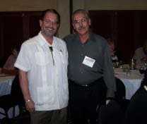 Secretary Alfred Vigil M.D. and Executive Director of El Paso Mario Saenz pause during one of the breaks at the Inn and Spa at Loretto which housed the annual imatter Conference.