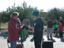 Erik Erickson receives medal from Maralie Waterman-BeLonge.