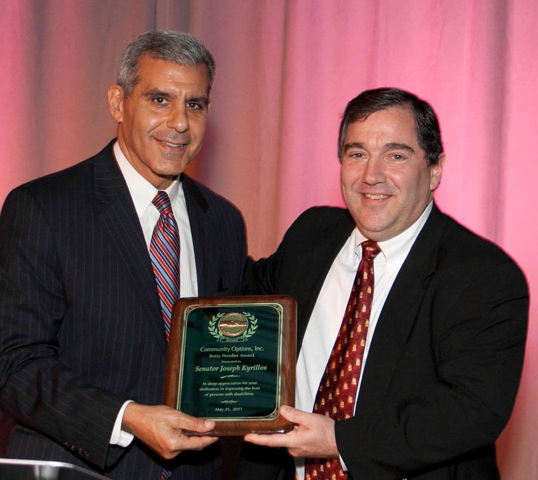 Senator Joseph Kyrillos accepts the Betty Pendler Award presented by Timothy P. Dunigan, Chairman of the Board of Directors, Community Options, Inc.