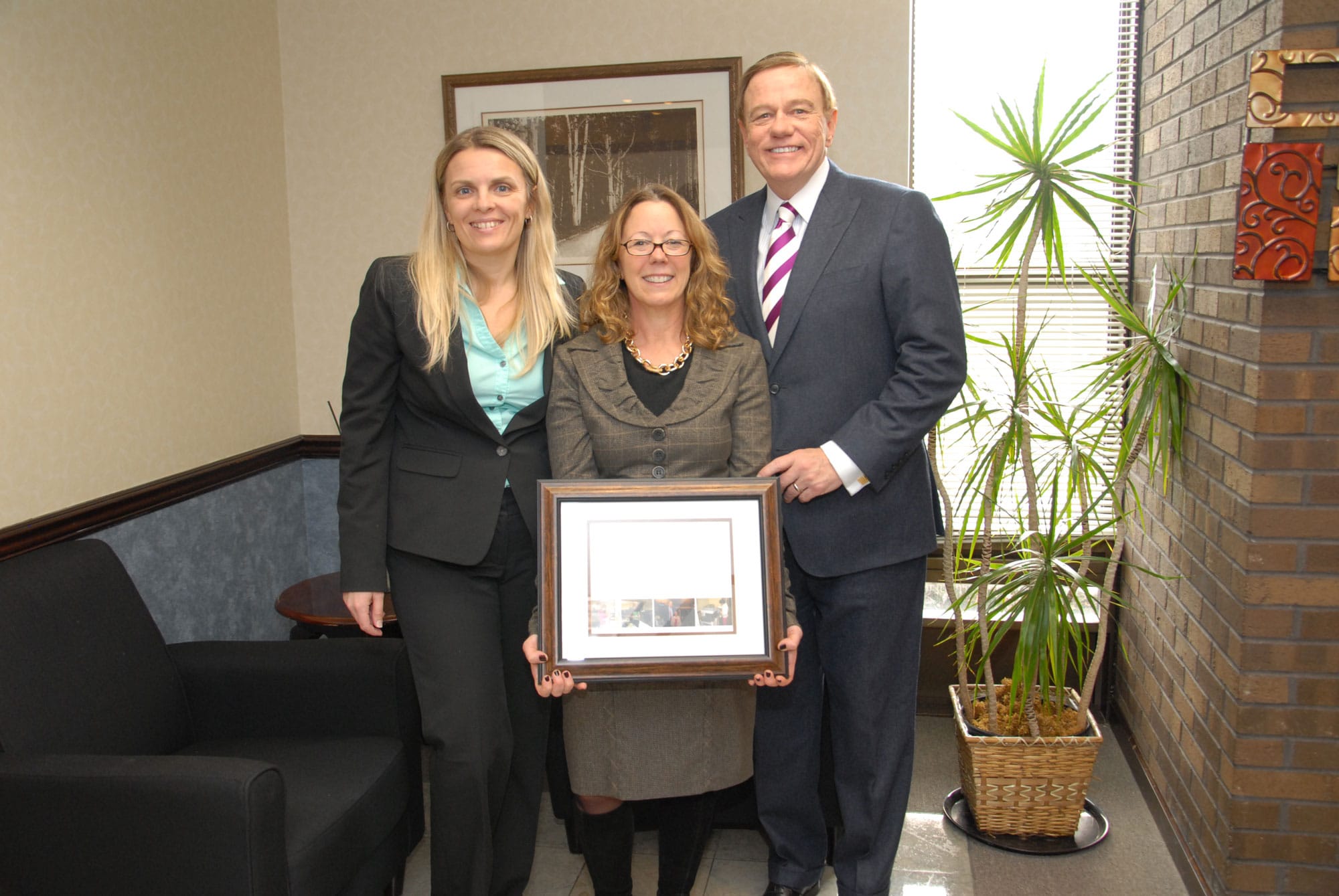 From left: Svetlana Repic-Qira, Regional Vice President of New Jersey for Community Options; Elizabeth Connolly Acting Commissioner of the New Jersey Department of Human Services; Robert Stack, Founder President and CEO of Community Options. Community Options presented Ms. Connolly with a plaque to commemorate her visit to the Daily Plan It in Princeton, New Jersey.
