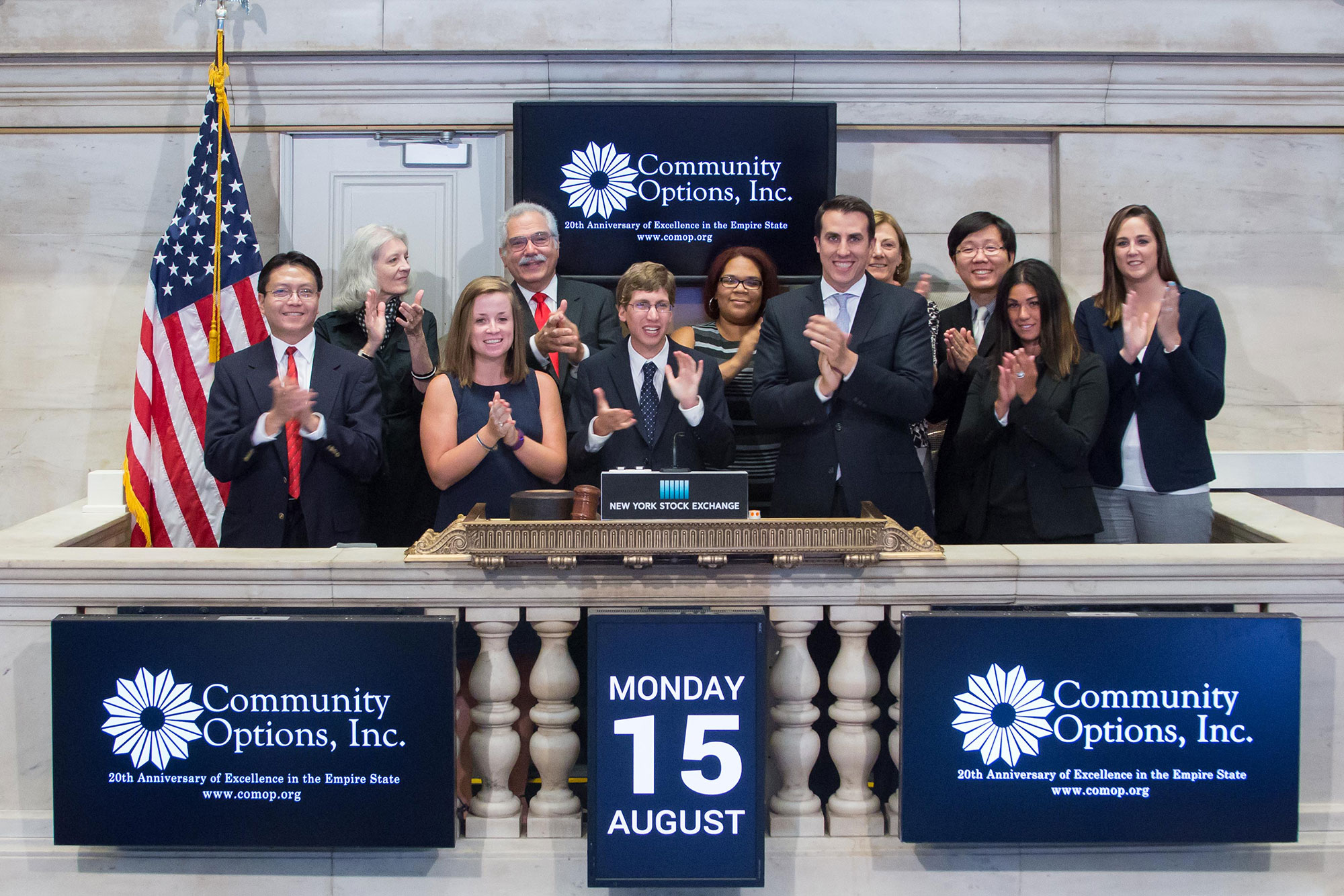 Officials and guests of Community Options, Inc. visit the New York Stock Exchange. Max Depelteau (5th from left), an individual served by Community Options, Inc., rings the NYSE Closing Bell® to highlight their 20th Anniversary of providing services throughout NY State. Photo Credit: NYSE