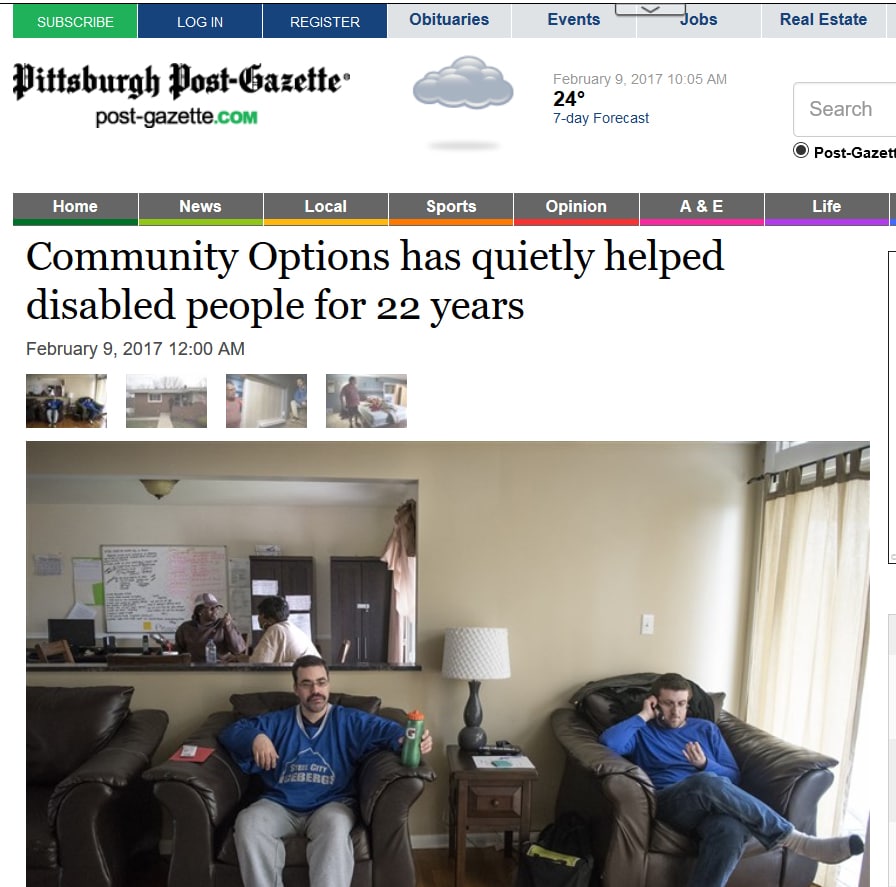 Michael Perret, left, and Philip Wilsher watch TV while two Community Options employees chat in the background at their home Wednesday in Baldwin.
