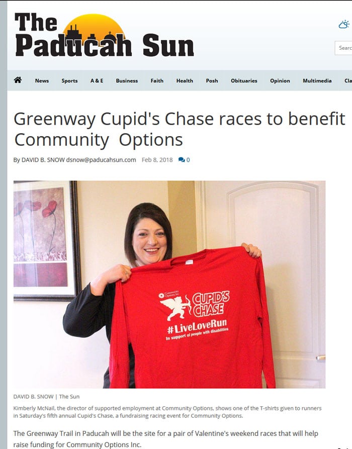 Kimberly McNail, the director of supported employment at Community Options, shows one of the T-shirts given to runners in Saturday's fifth annual Cupid's Chase, a fundraising racing event for Community Options.