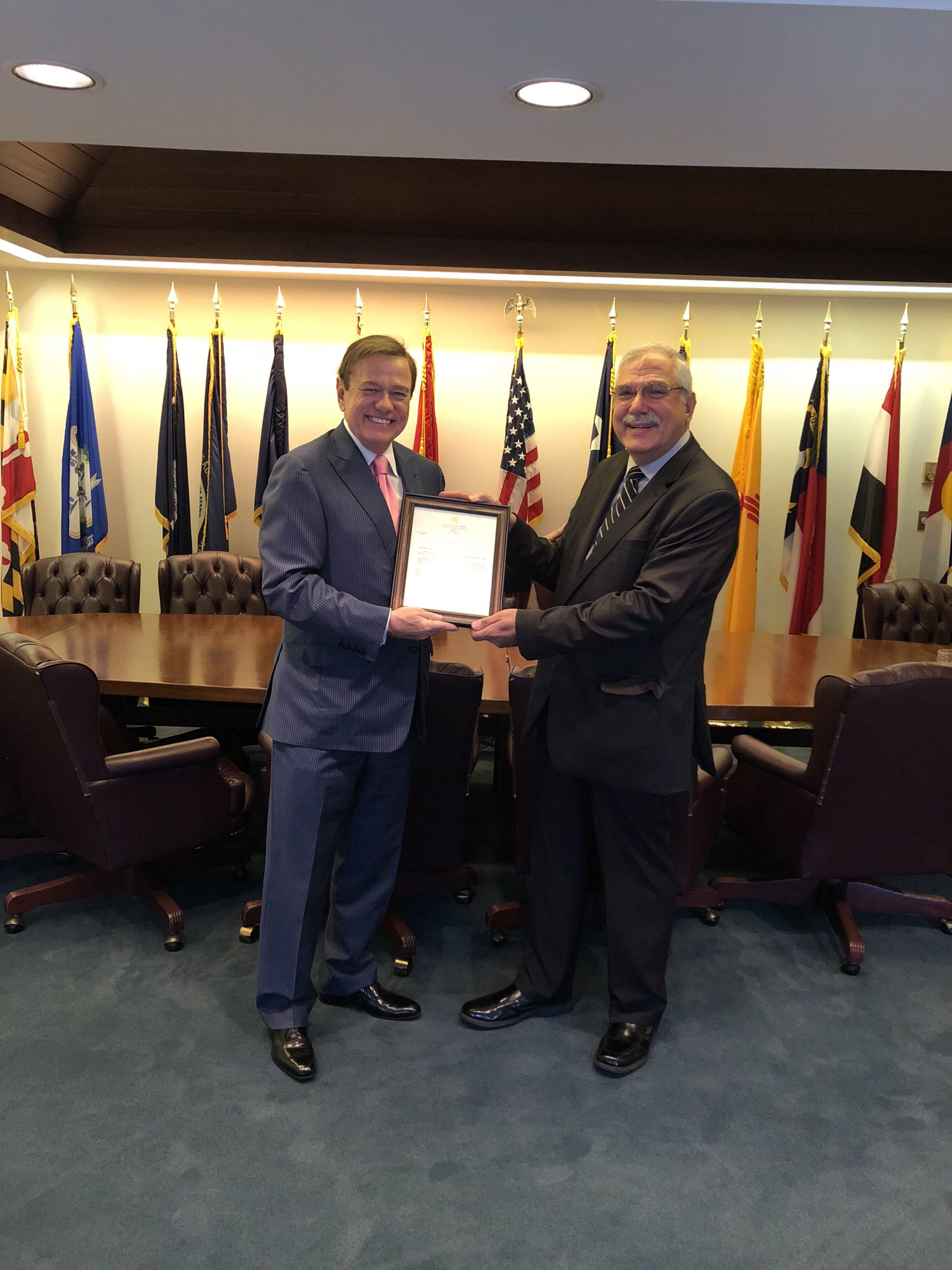 Robert Stack, President & CEO of Community Options presents the letter from Governor Murphy to Philip Lian.