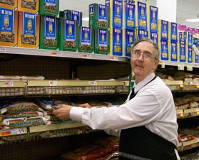 COI Supported Employment Man restocking shelves