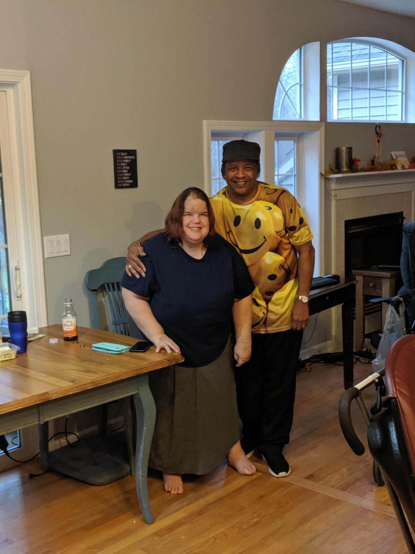 A woman standing with Leon Howze