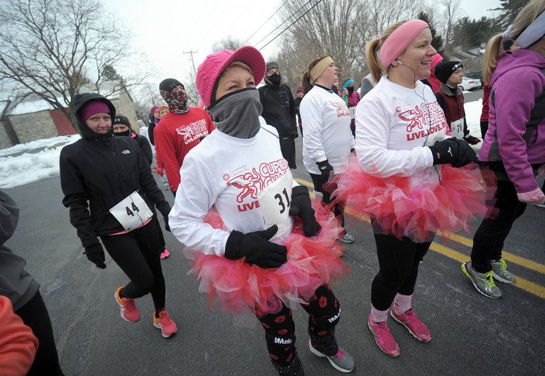 Matt Smith | For NJ Advance Media Cupid's Chase 5k held in Upper Macungie Township on Feb. 14, 2015 Angie Fenstermaker, left, of Allentown, and Wendy Bartkus, right, of Emmaus, are dressed up at the starting line during the Cupid's Chase 5k at Bob Rodale Cycling and Fitness Park in Upper Macungie Township on Feb. 14, 2015. Runners braved cold conditions to participate in the event coordinated by Community Options, Inc. which provides housing, support services and advocacy assistance to help individuals with disabilities.