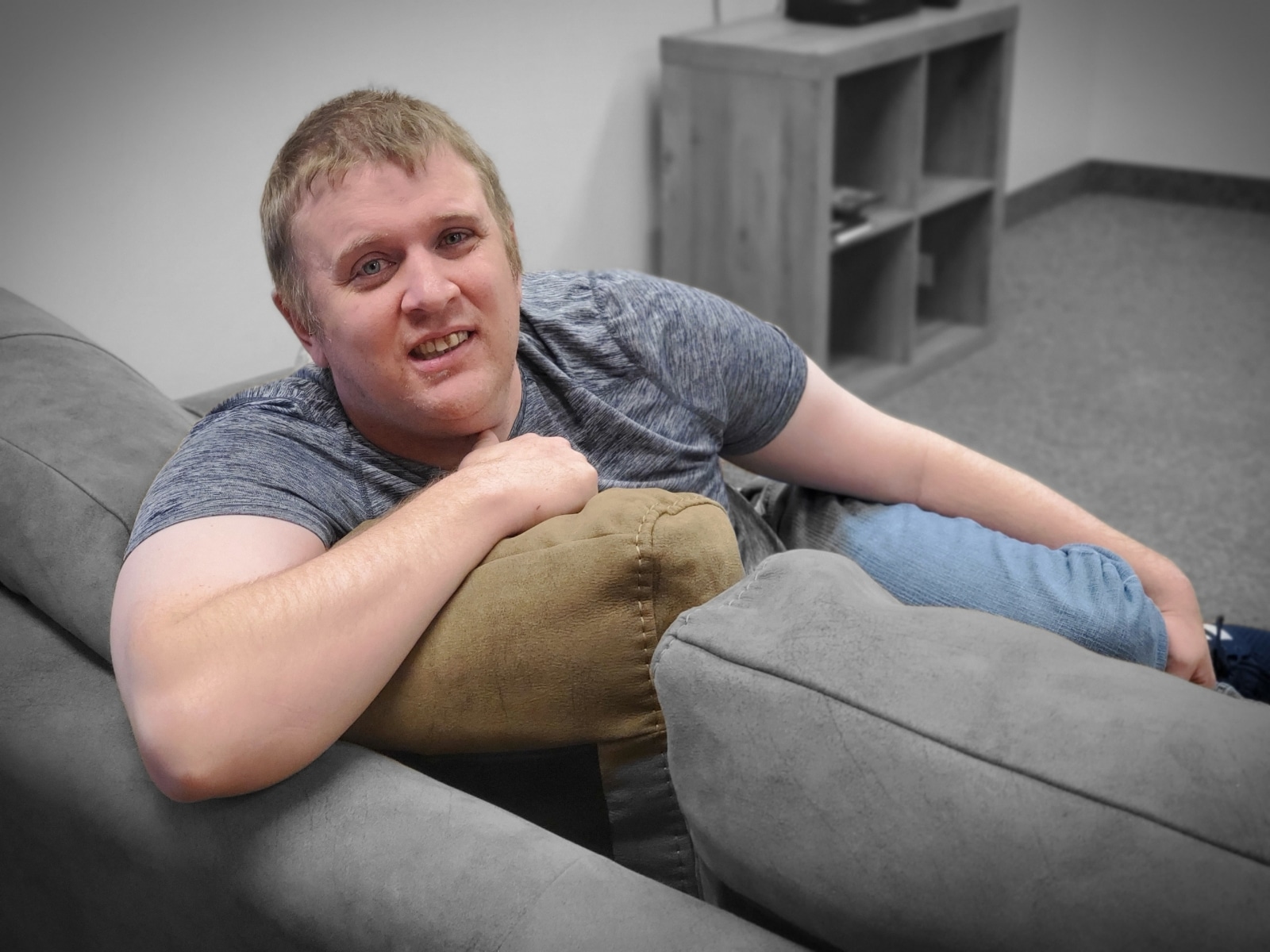 Ryan sitting on a comfy couch