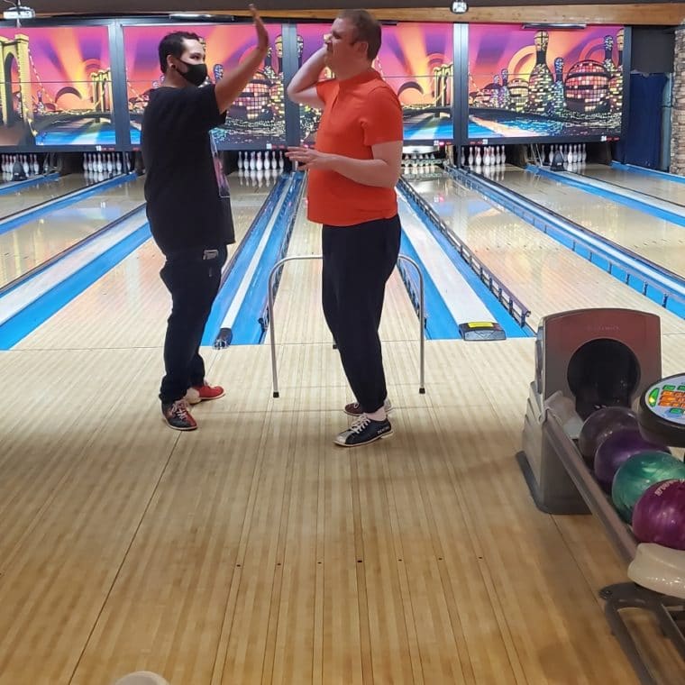 Ryan bowling giving someone a high five