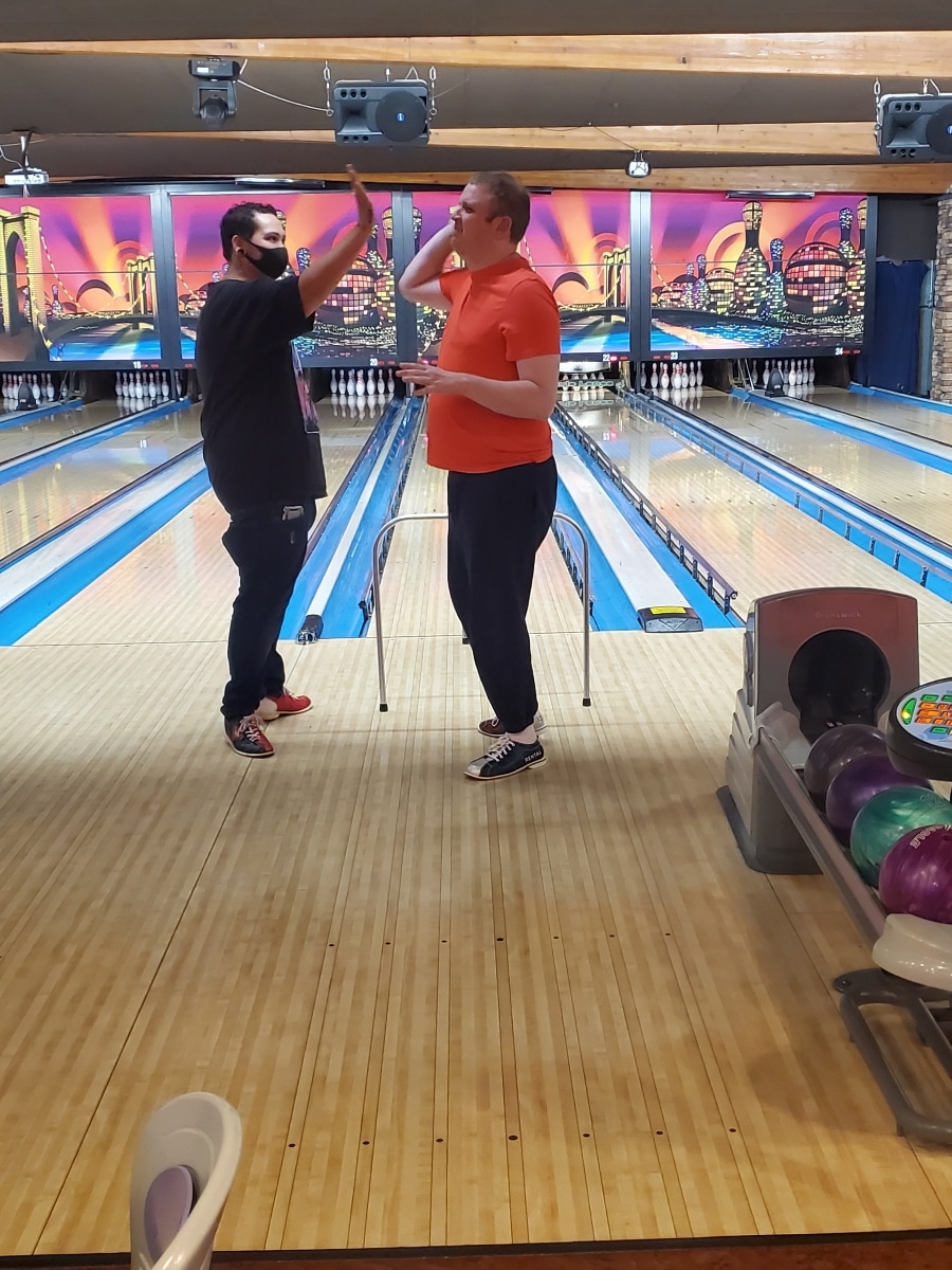 Ryan bowling giving someone a high five