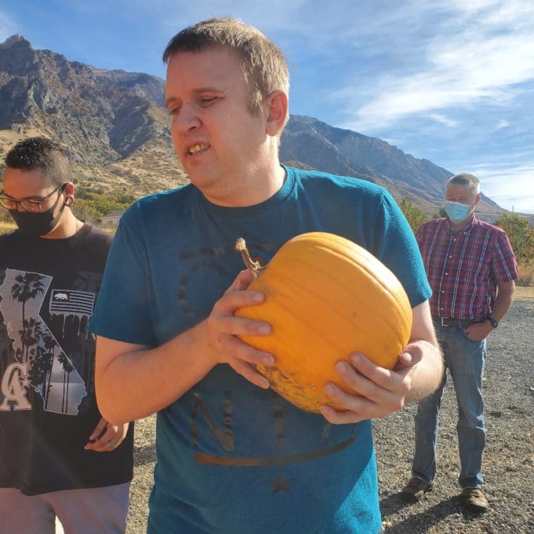 Ryan holding a pumpkin