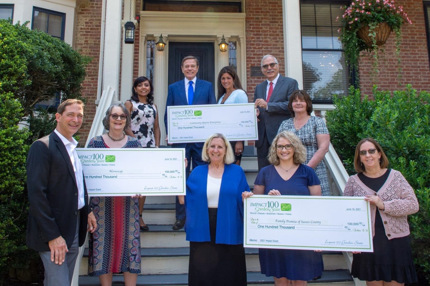 Impact 100 Garden State $100,000 Grant Recipients Front row, from left: from Norwescap: Mark Valli, CEO; Libby Haynes, Assistant director; Cecilia Genao, Program Coordinator; Debby Seme, President, Impact 100 Garden State; from Family Promise of Sussex County: Nichole Reed, Events Coordinator; Nancy Renna, Bookkeeper; Chris Butto, CEO. Back row, from left, from Community Options Enterprises: Robert Stack, President/CEO, Community Options, Inc; Dina Casalaspro, Managing Director; Phil Lian, Chairman of the Board.