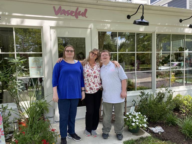 Kathy Angelinovich, center, manager at Vaseful Flowers at 305 Witherspoon Street, leans on her staffers from Community Options, Clare and Andrew - Photo Credit: TAPinto Staff