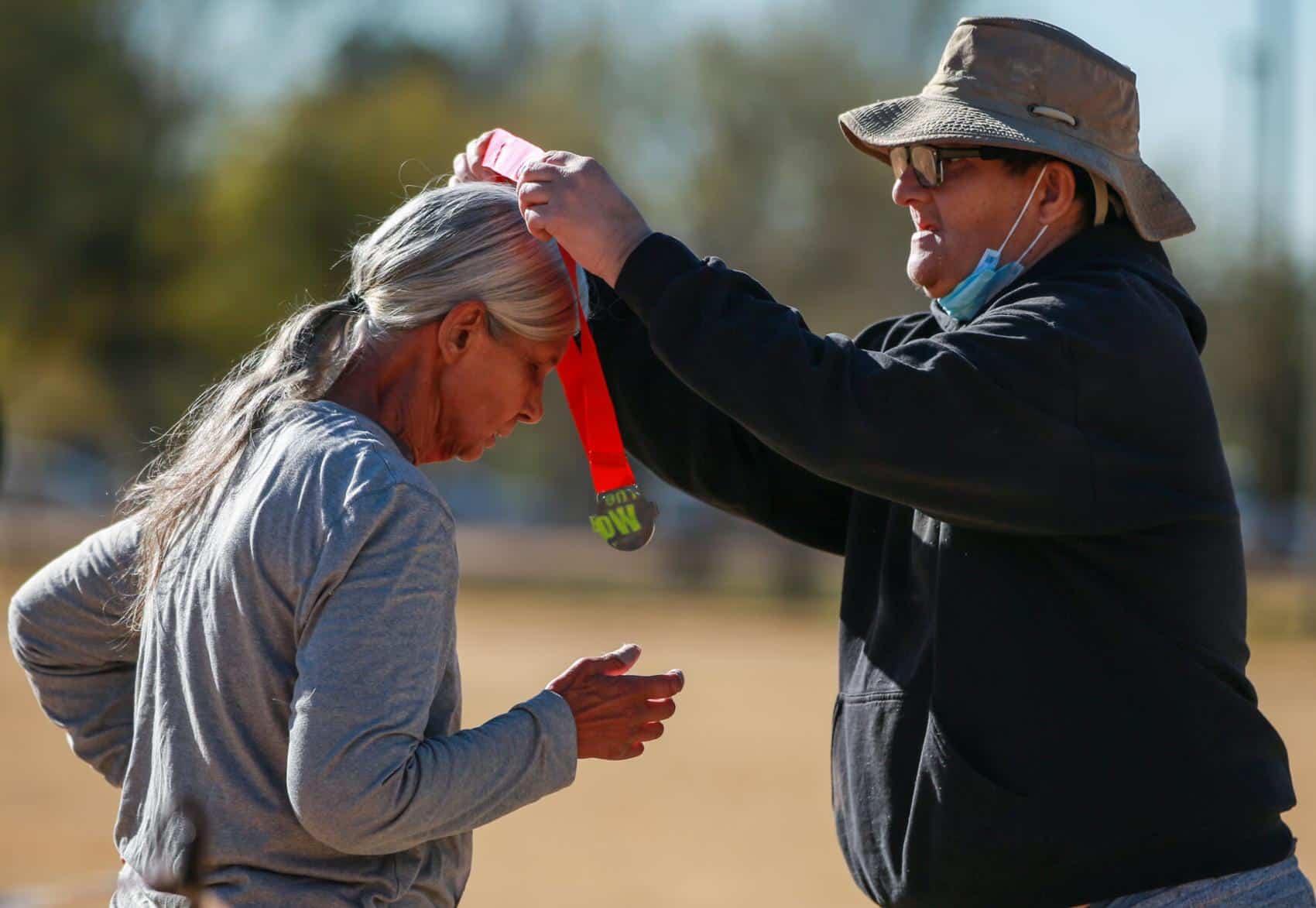 Jose Olivares places a medal on Connie Lopez after finishing the Cupid's Chase 5K Run on February 12, 2022 at Reid Park. Jose is one of the members that this race is supporting. Ana Beltran, Arizona Daily Star - tucson.com