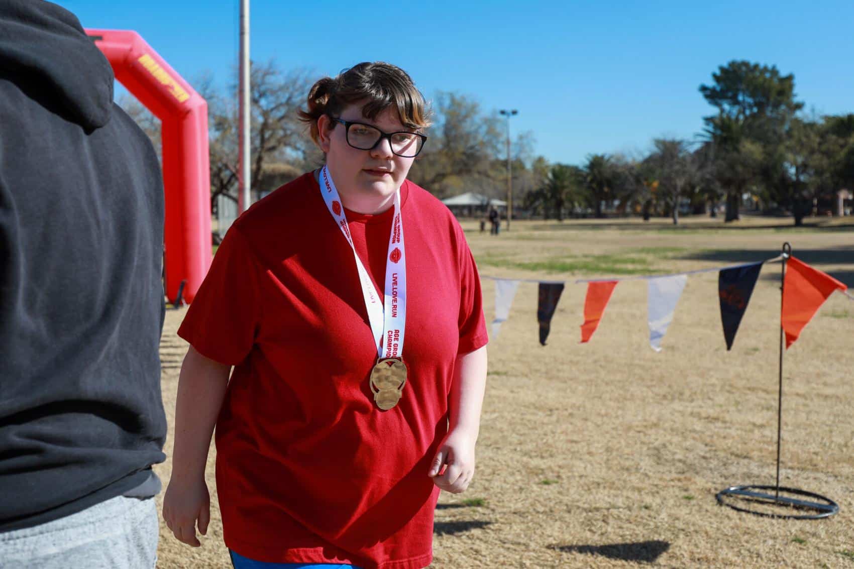 Sarah Coulter finishes walking the 5k Cupid's Chase Run on February 12, 2022 at Reid Park. Sarah is one of the members that is supported with the Cupid's Chase 5k run. Ana Beltran, Arizona Daily Star - tucson.com