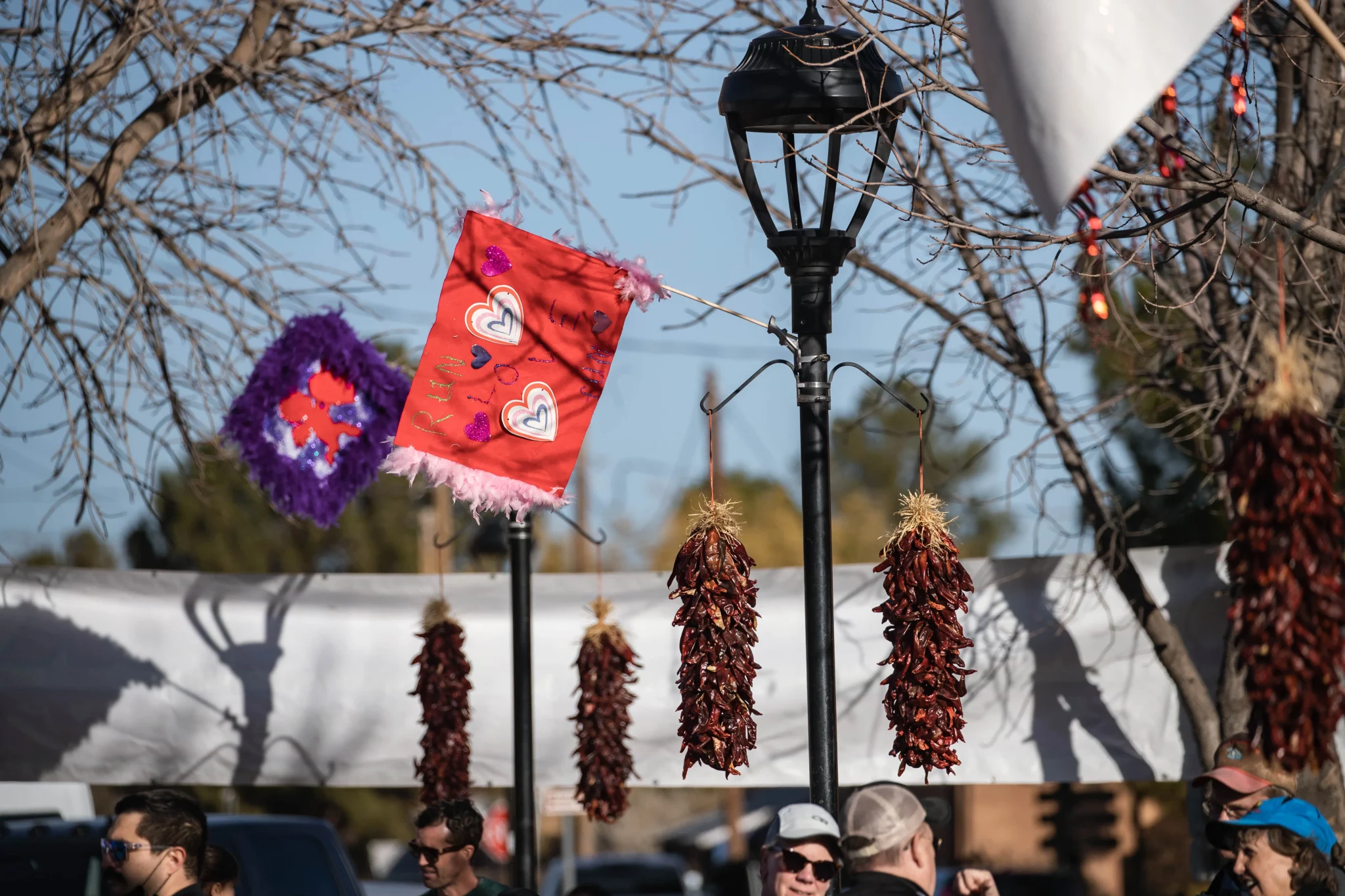 Flags hang Mesilla Plaza at the Cupid's Chase 5K in Mesilla on Saturday, Feb. 12, 2022 Nathan J Fish/Sun-News - lcsun-news.com