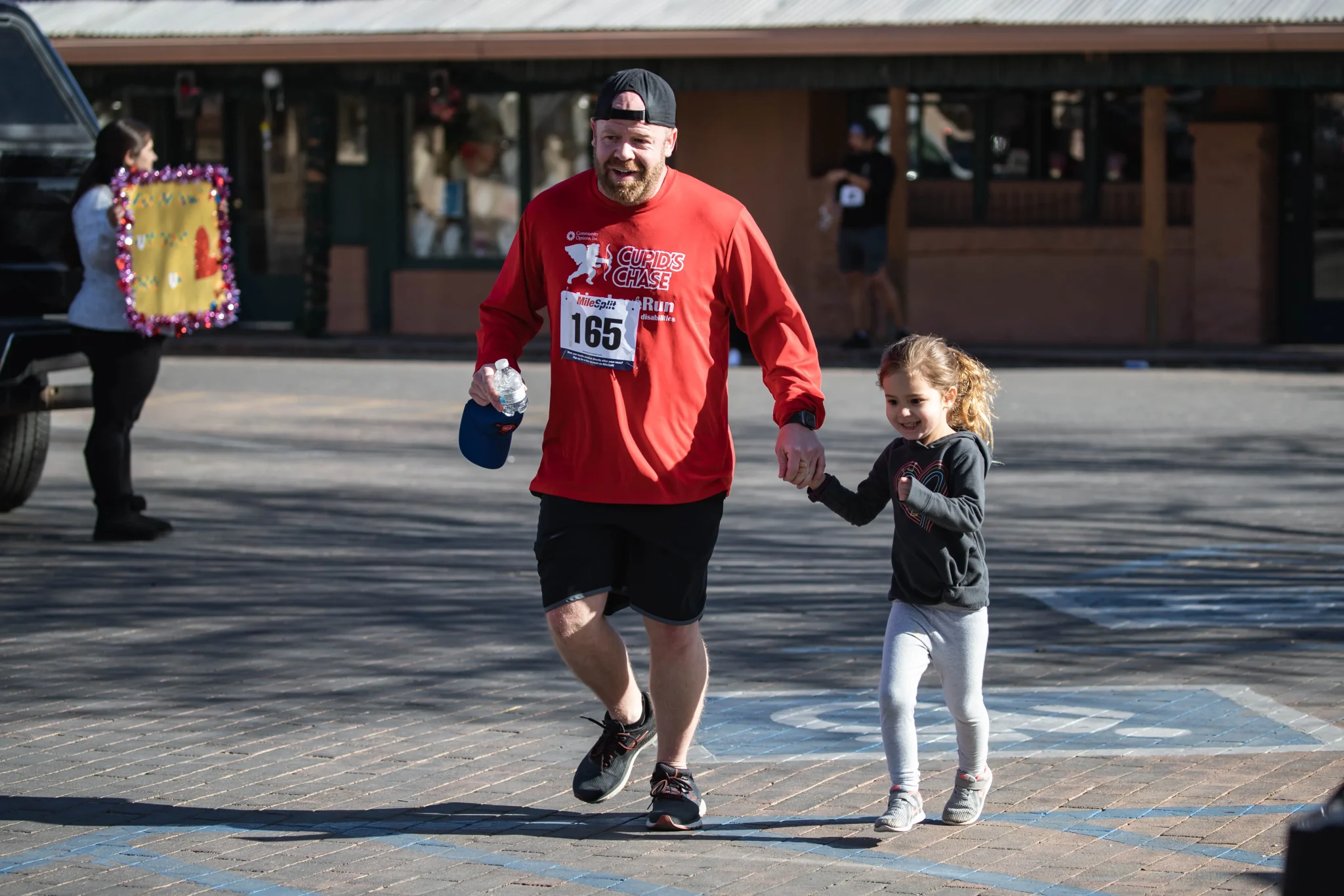 Runners finish at the Cupid's Chase 5K in Mesilla on Saturday, Feb. 12, 2022. Nathan J Fish/Sun-News - lcsun-news.com