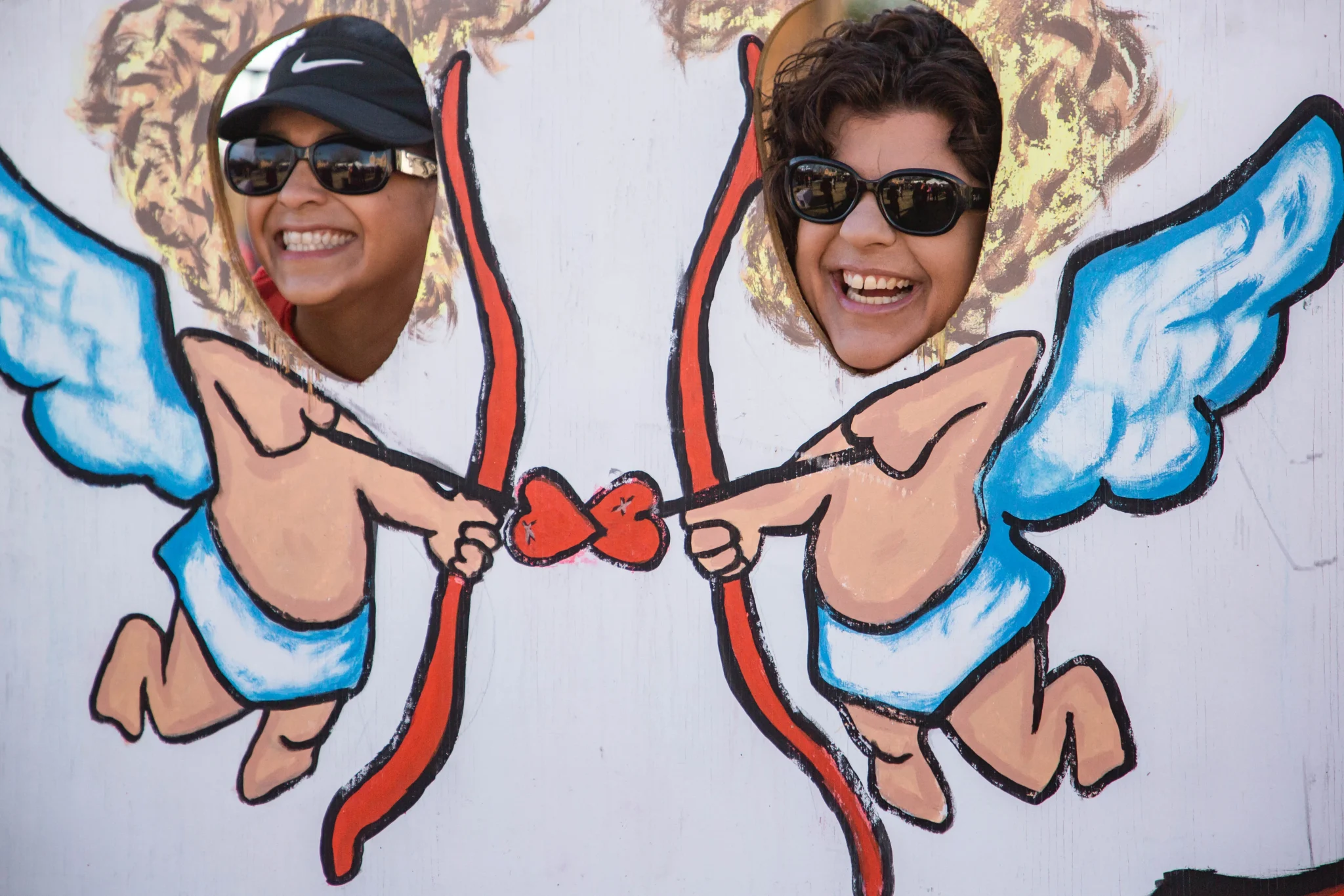 Runners take photos at the Cupid's Chase 5K in Mesilla on Saturday, Feb. 12, 2022. Nathan J Fish/Sun-News - lcsun-news.com