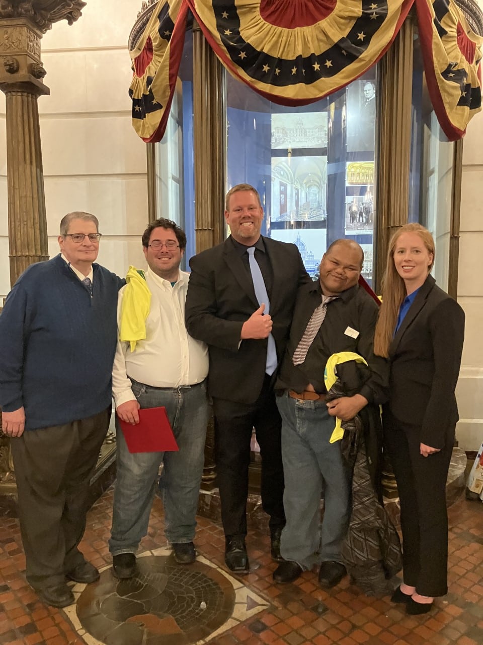 Executive directors Tabitha Buchinsky and Stephen Hall are pictured here with senior direct support professional Bruce Hall and two individuals supported by Community Options Inc. This group made the early morning trip from western Pennsylvania to the capitol in Harrisburg to advocate for the need of increased wages for direct care workers.