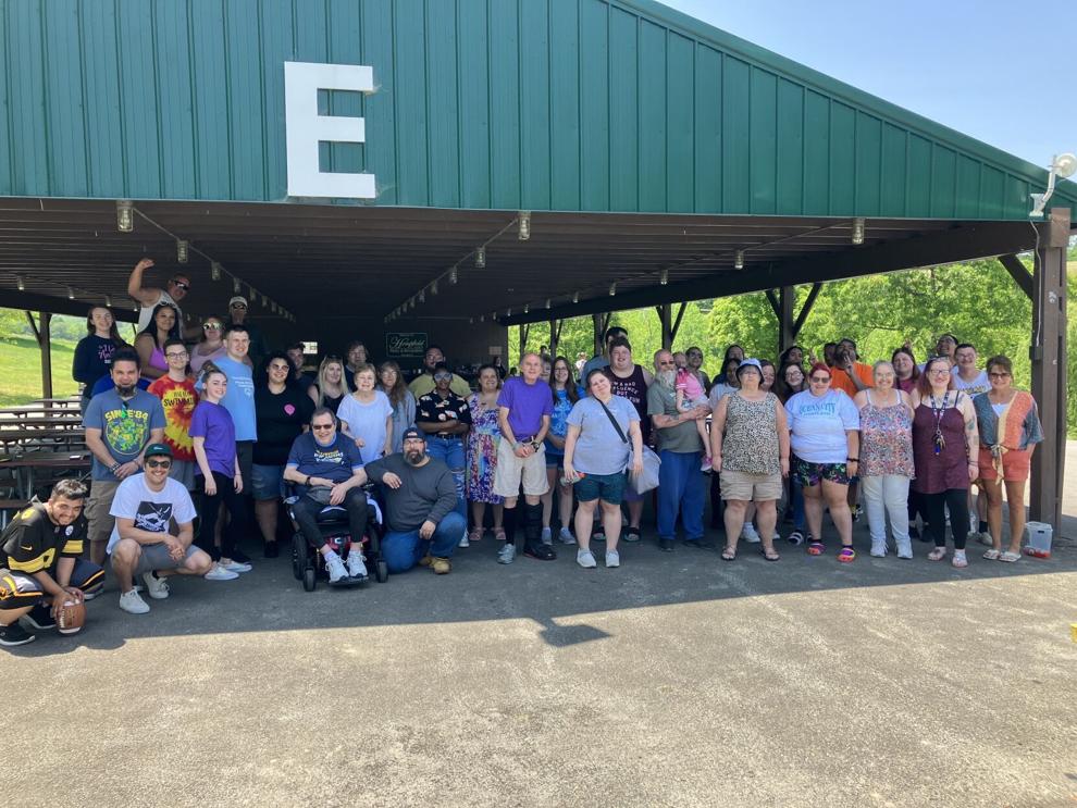 Individuals and staff with the Community Options Westmoreland Region at the company picnic last month in Hempfield Township. Community Options is hosting a July 9 dance at the PBR Room in the Live! Casino Pittsburgh for its clients and the community.