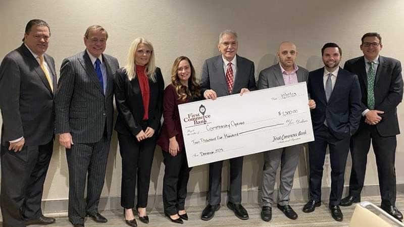 Community Options receives donation from First Commerce Bank.