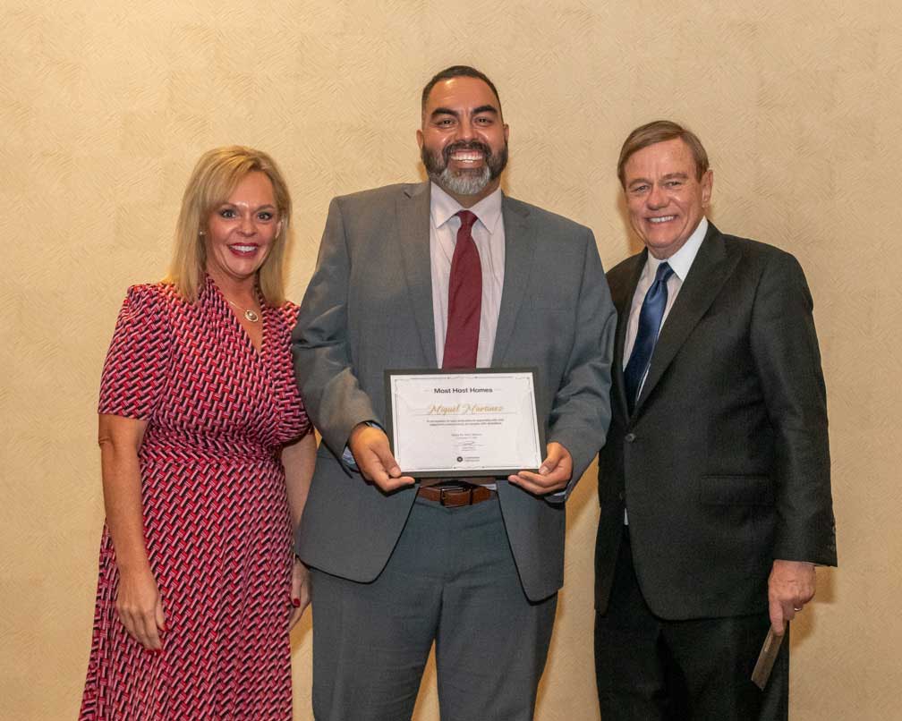 Robert Stack, Chief Executive Officer of Community Options and Monica Graf, Texas State Director Present Miguel Martinez with a Certificate of Achievement for Most Host Homes In recognition of your dedication to expanding safe and supportive environments for people with disabilities presented in Santa Fe, New Mexico on September 17, 2024