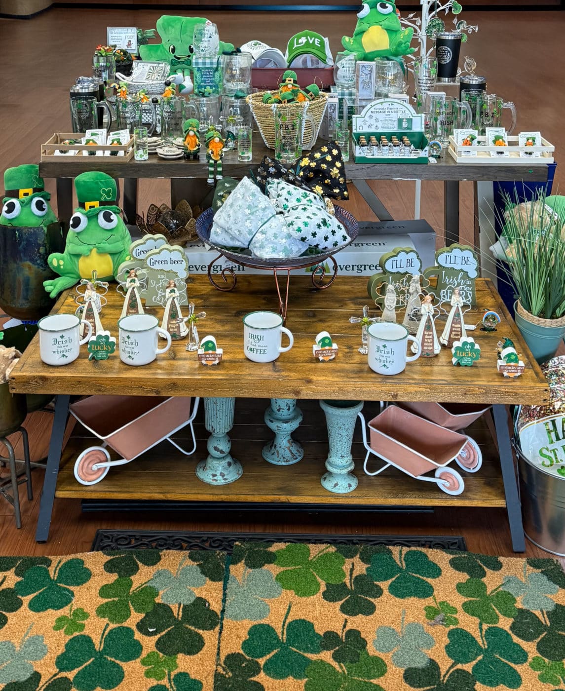 A St. Patrick’s Day display at Presents of Mind gift shop featuring green shamrock decorations, Irish-themed gifts, and festive holiday items. Find unique St. Patrick’s Day décor and gifts while supporting employment for people with disabilities. Located at 240 US-206, Flanders, NJ 07836. Shop online at presentsofmind.org.