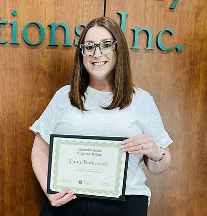 Behavior Support Manager, Jaime Rutkowski, accepting her Leadership Academy Certificate.