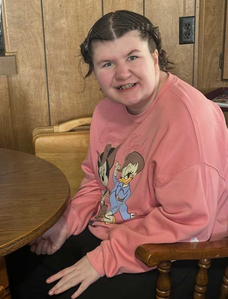 Haylie sitting at a table in Salt Lake City, UT