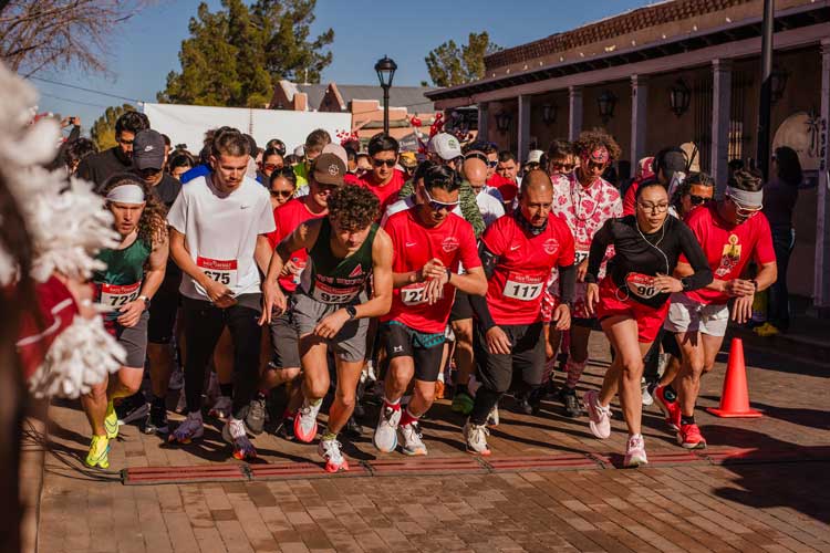 Runners at starting line of the Cupid's Chase 5K on February 14, 2026 Old Mesilla Plaza, Las Cruces, NM