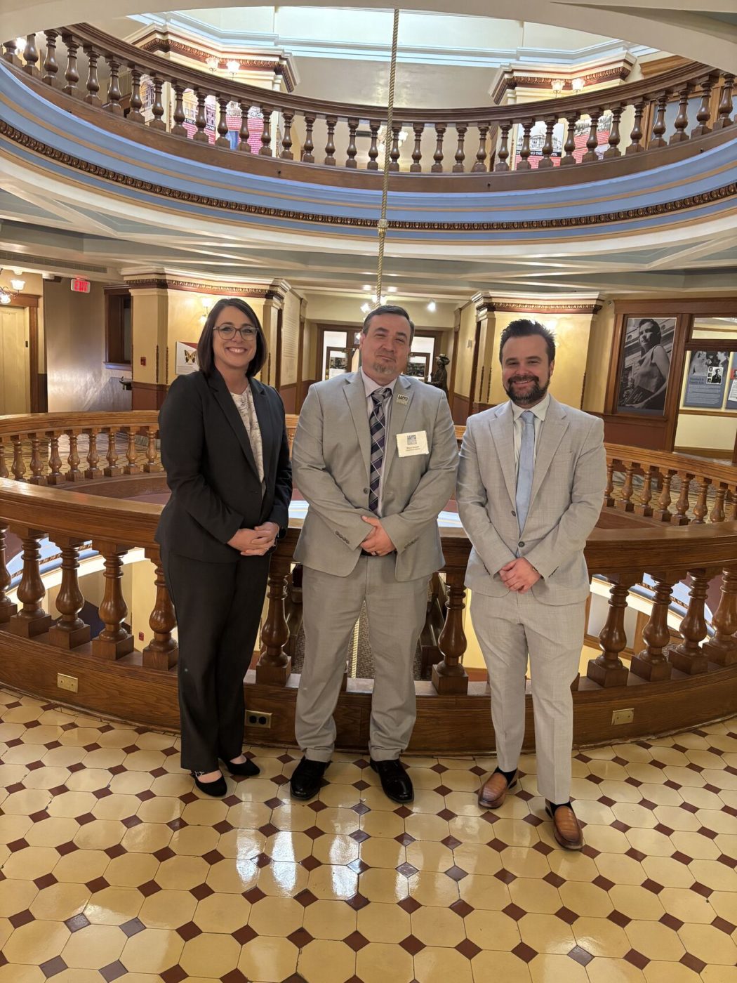 From right to left, Community Options leaders Michael Burnett, Shaun Crouse, and Kathryn Valles-Wallace standing in the Arizona State Capitol’s rotunda on February 02, 2026.
