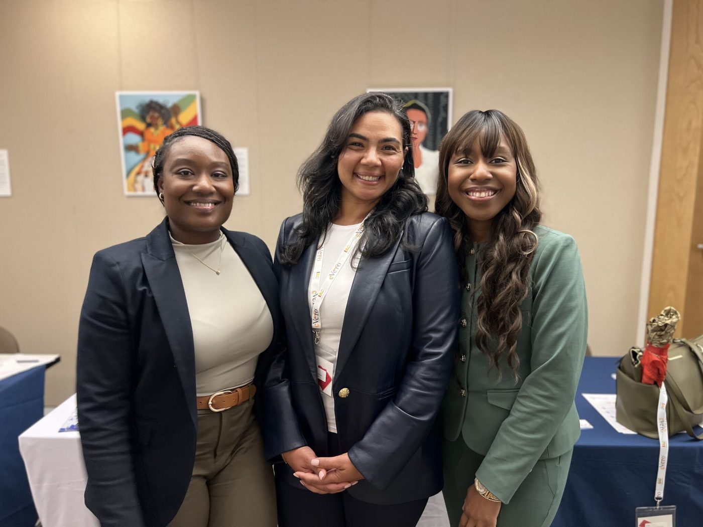 Fatimat Adekoya and Maggie Farag standing with Sherifat Amponsah at the IAC 13th Annual Conference in New York City.