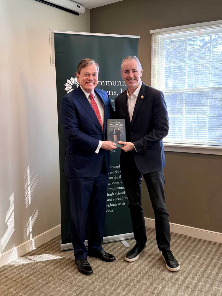 Left to Right, Robert Stack with Brian Fitzpatrick holding a copy of Silent No Longer