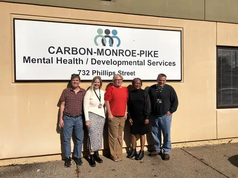 Community Options leadership and Carbon-Monroe-Pike County intellectual disability administrators pose together during a September 2023 planning meeting focused on expanding services in northeastern Pennsylvania.