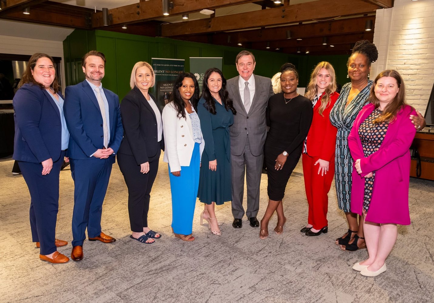 Lindsey Daniel, South Carolina State Director; Michael Burnett, Regional Vice President for Arizona and Utah; Noemi Rivera, New Mexico State Director; Tigest Alemu, Maryland State Director; Samantha Cutler, Regional Vice President for Texas and New Mexico; Robert P. Stack, Founder, President and Chief Executive Officer of Community Options; Fatimat Adekoya, New York State Director; Ashlyn Visser, Utah State Director; Meika McClendon, Tennessee State Director; and Lacie Parker, Vice President, Pennsylvania, are pictured on May 19, 2025, at Union League Liberty Hill in Lafayette Hill, PA, during the annual Phil Lian and Joan Mueller Phenomenal Golf Classic. A $200,000 matching gift from Lian and Mueller helped raise $500,000 to support people with disabilities.