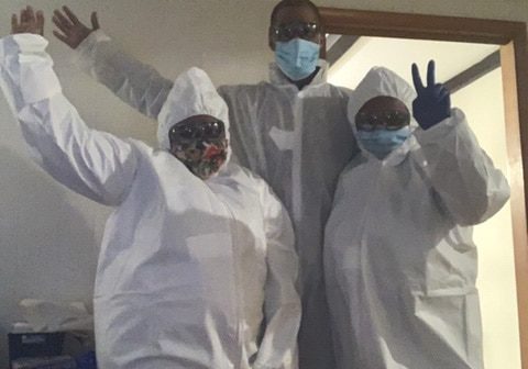 Nysheema Epps, Bryant DeShields, and Jerome White from Burlington, NJ donning their own personal protective equipment.