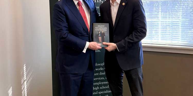 Left to Right, Robert Stack with Brian Fitzpatrick holding a copy of Silent No Longer